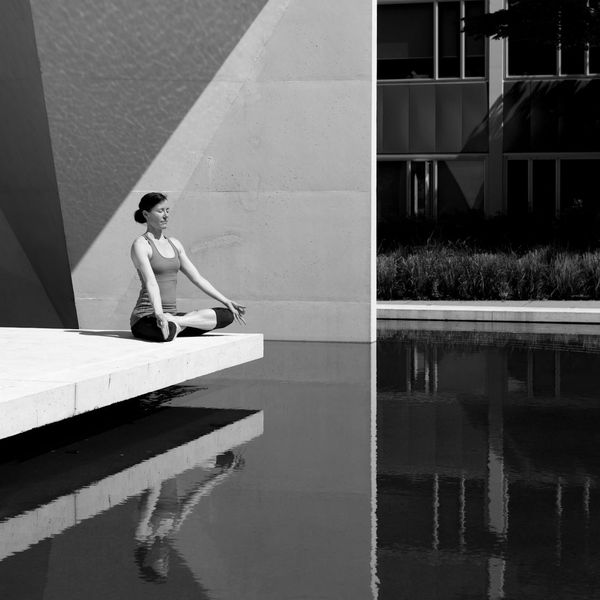 Person meditating peacefully outdoors, symbolizing mental clarity.